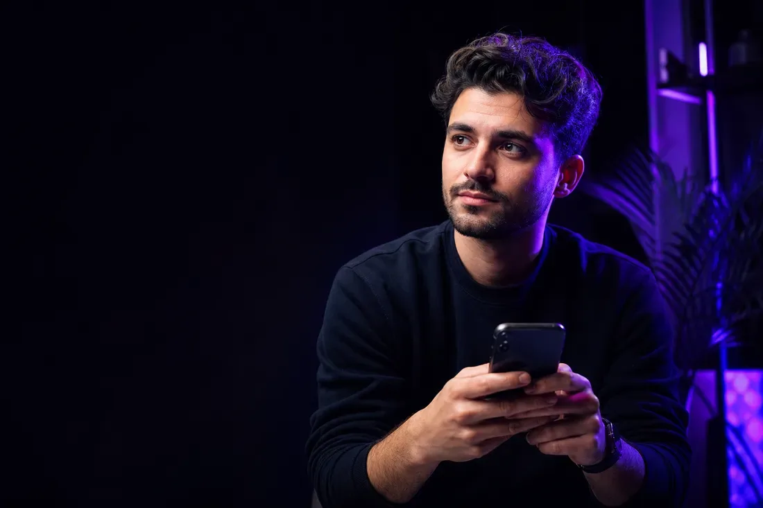 A customer reflecting while sharing feedback on a smartphone
